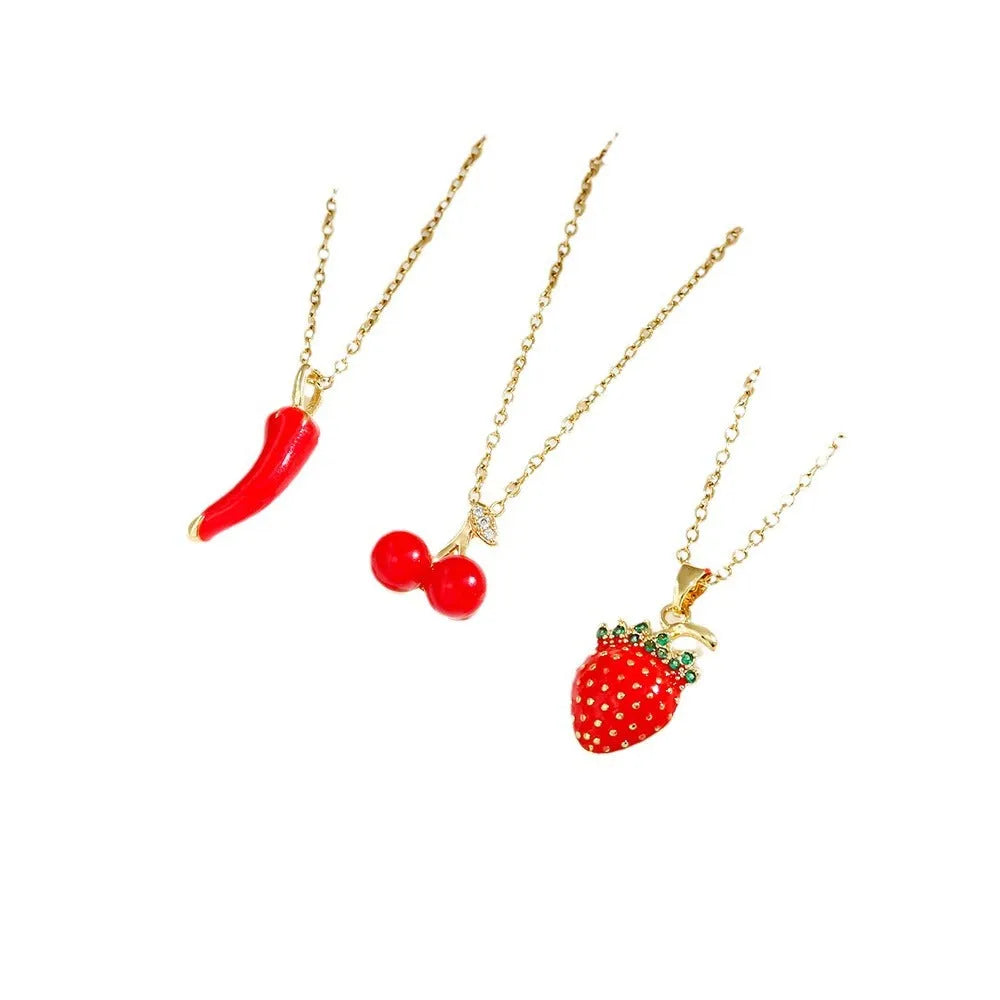 Golden indie necklace with detailed cherry, strawberry, and pepper pendant on a titanium steel O-ring chain.