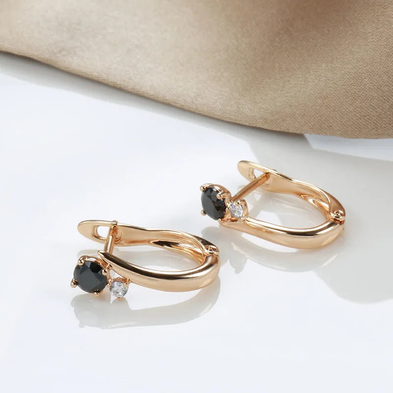 Gold geometric drop shape earrings with black agate stones, retro cold wind style.