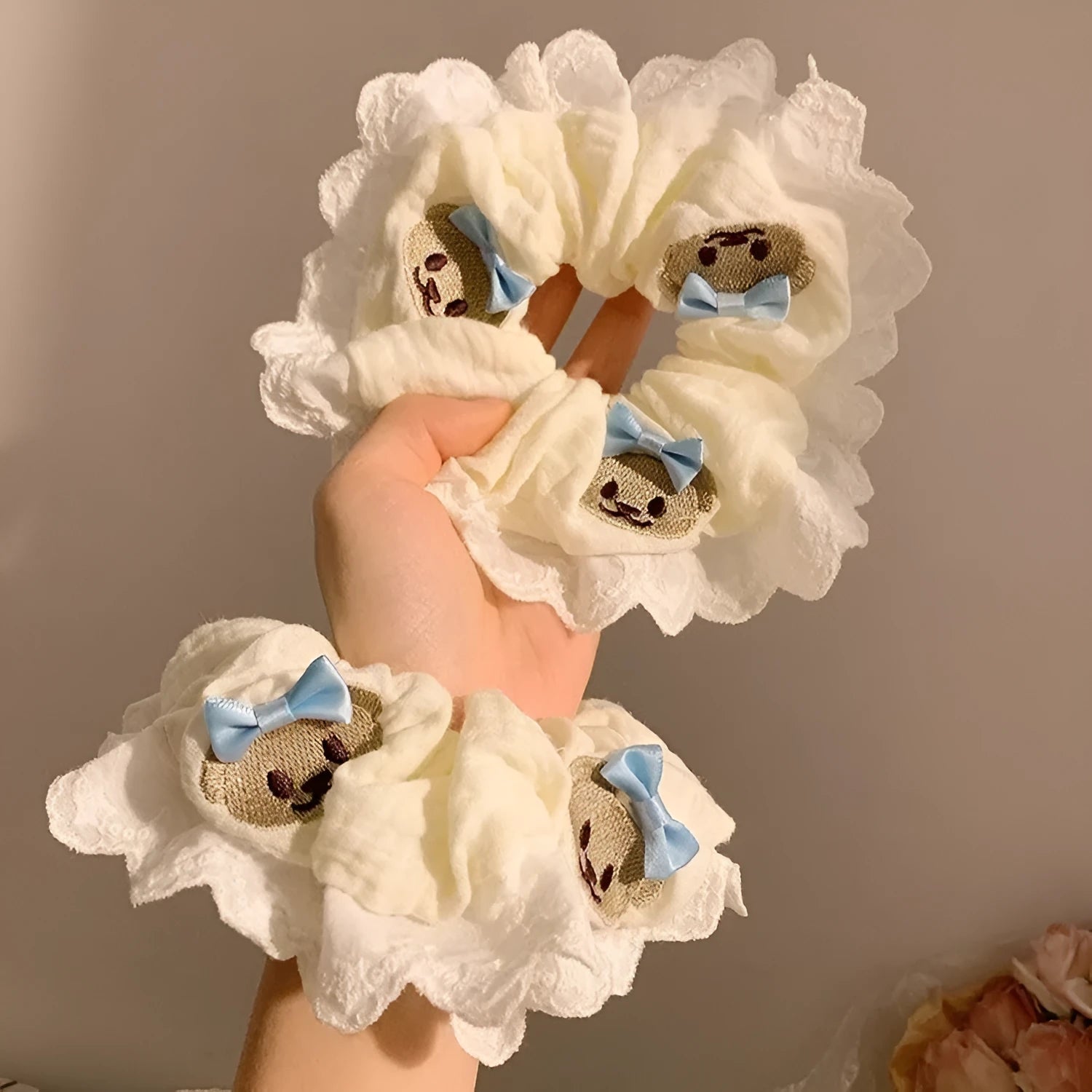 Bear blue large intestine hair ring with a cloth bow and lace detail on a stretchable headband.