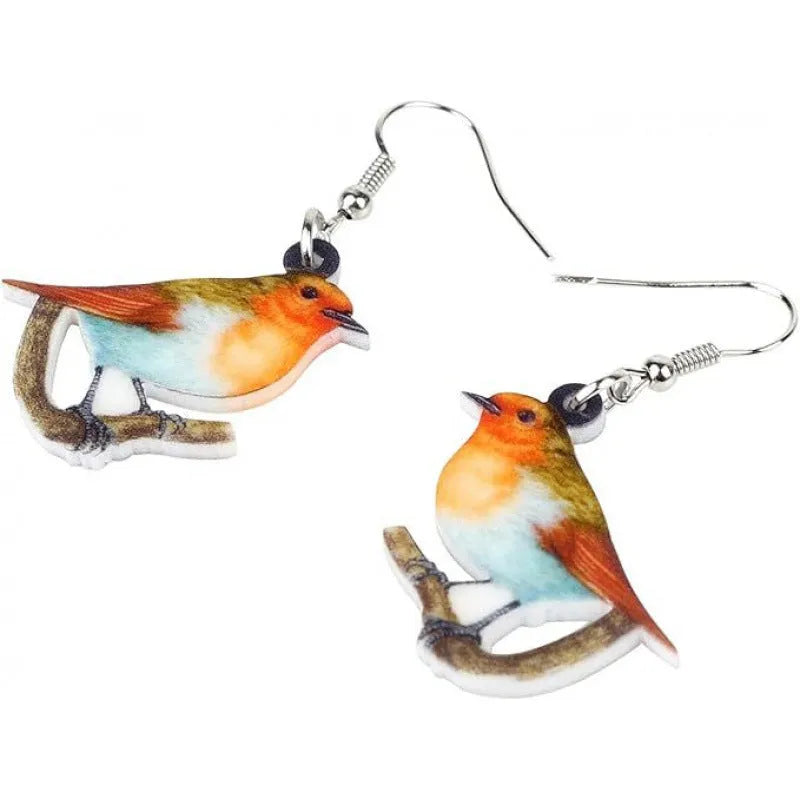Acrylic clip-on earrings with a blue titmouse bird and geometric snake design.