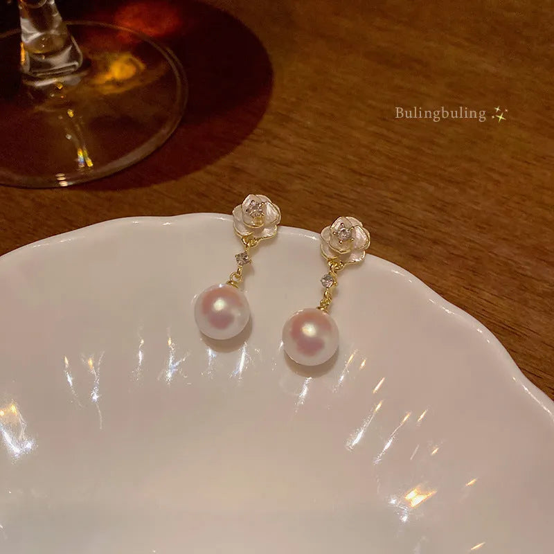Camellia pearl flower stud earrings for women with gold-tone alloy and faux pearl centre