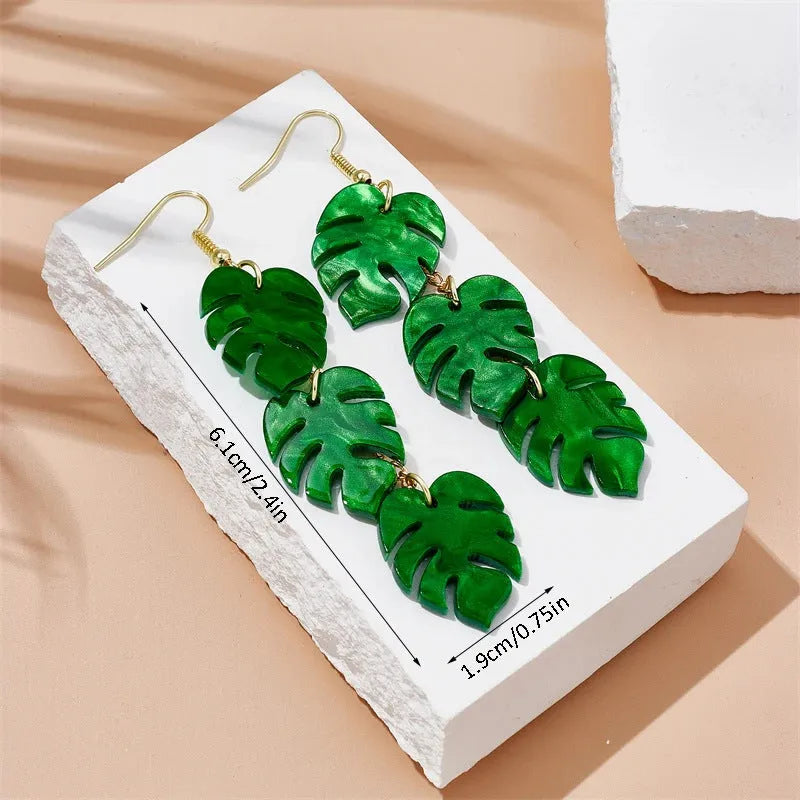 Drop shape earrings with a white acrylic coconut artocarpus charm and silver alloy hook.