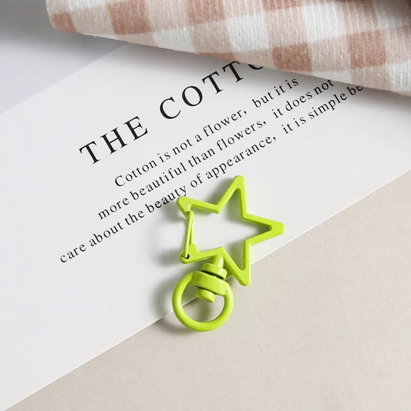 Metal five-pointed star snap button keychain with colour paint finish in alloy, small size, thirteen colour options including beige and sapphire blue