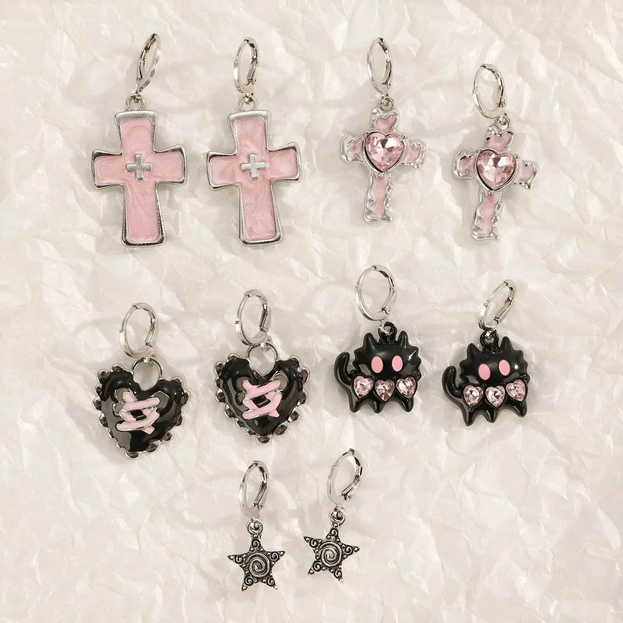 Women's alloy earrings with cross and heart designs in five colour variations including white, black cat, and antique silver