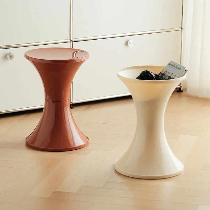 Plastic hourglass shoe changing stool in multiple colours with compact dimensions