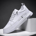 Men's casual skateboard shoes with microfiber upper and elastic band closure in white or black