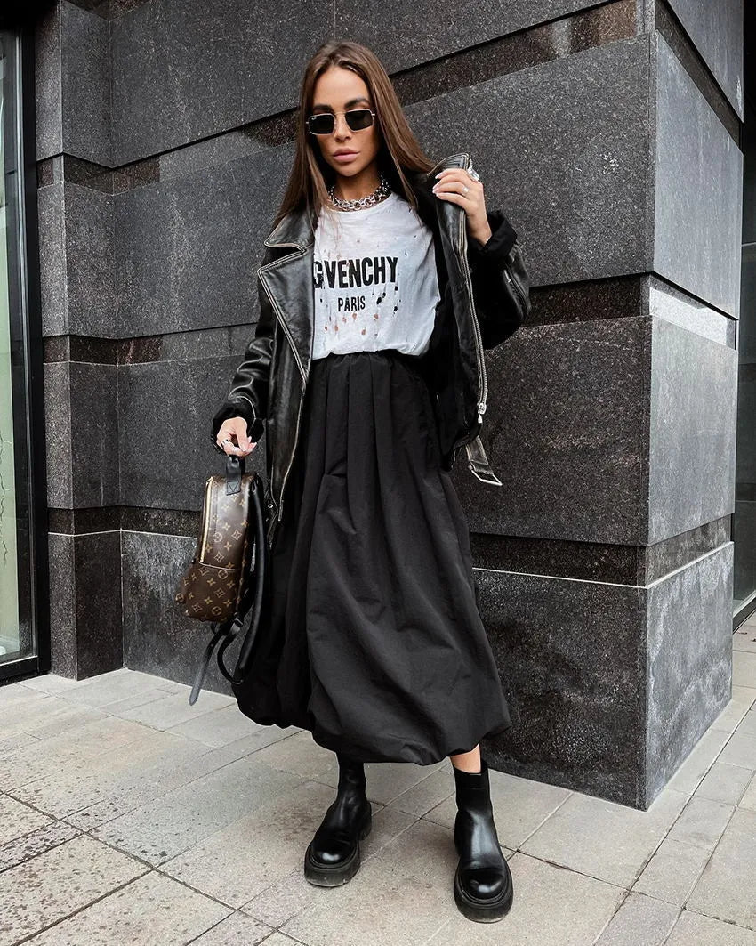 Women's solid colour cotton long skirt with elastic waistband in black or white.
