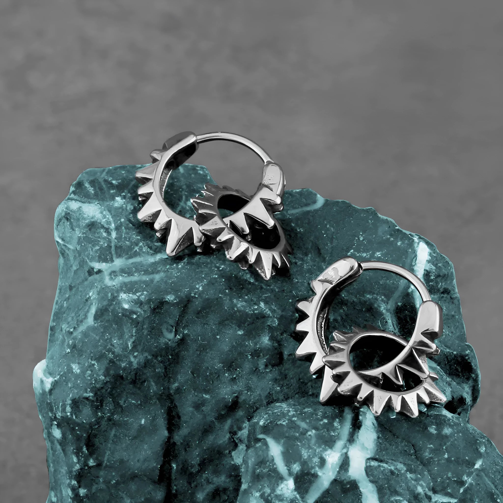 Polished stainless steel round ring earrings with retro design in steel colour