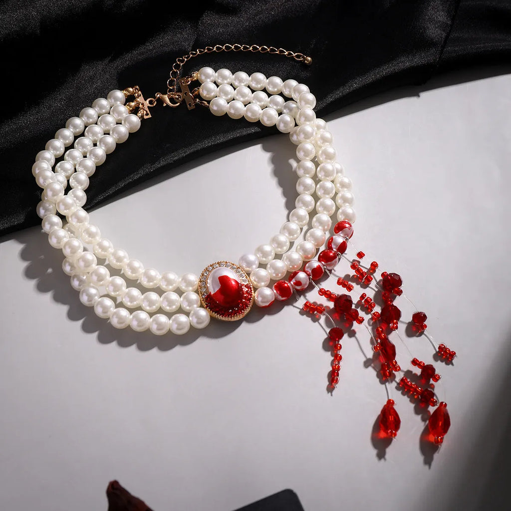 Halloween pearl collar necklace, stud earrings, and bracelet set in electroplated gold finishes.