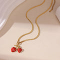 Stainless steel strawberry-shaped pendant necklace on an alloy chain in red or white gradient finish.