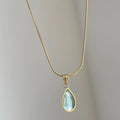 Retro water drop necklace with a blue or green gemstone pendant on a titanium steel snake bone chain.