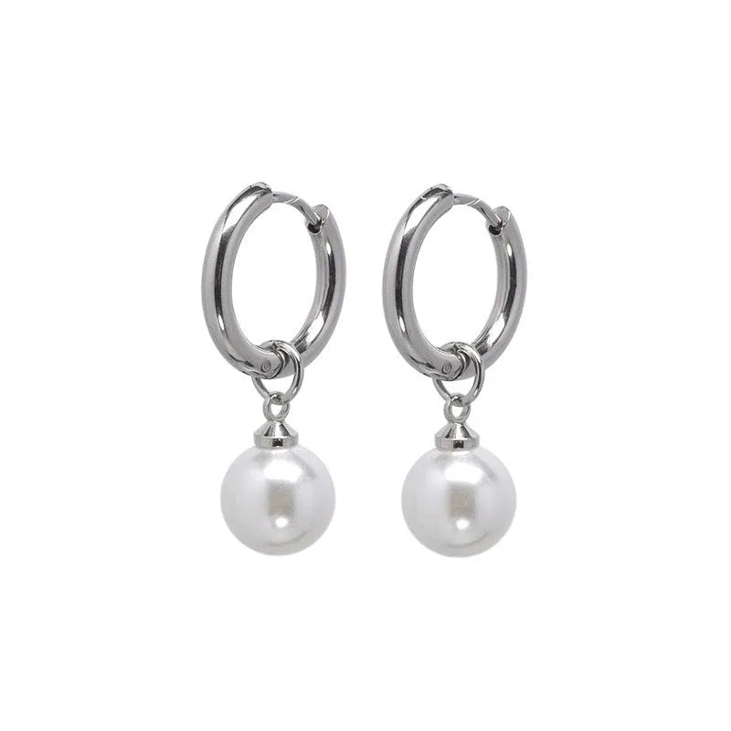 A pair of women's geometric alloy drop earrings with pearl finish and titanium steel posts.
