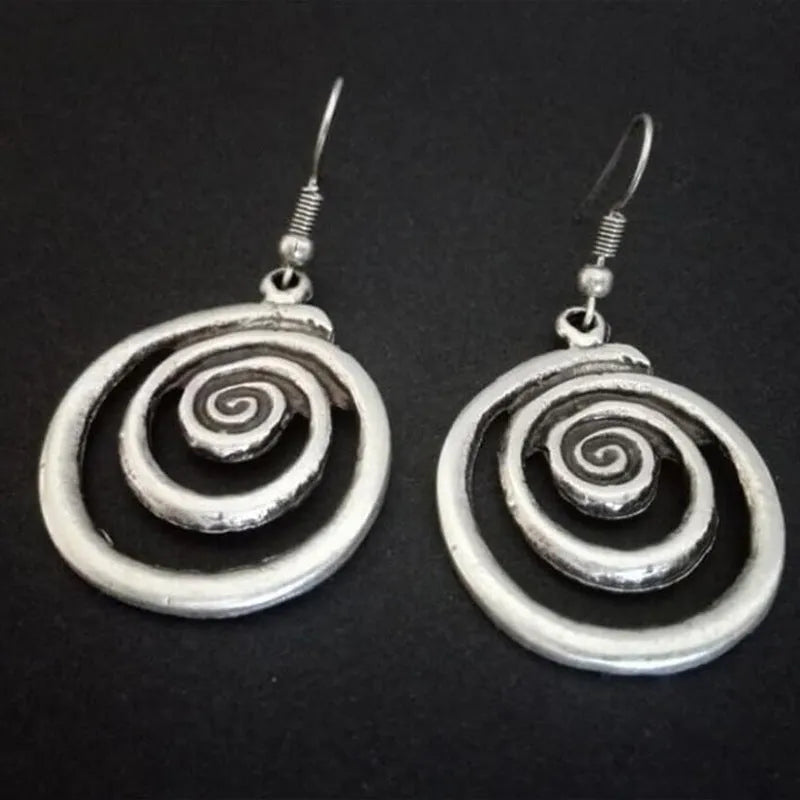 Geometric spiral earrings with distressed silver finish measuring 2.6cm wide by 5cm long