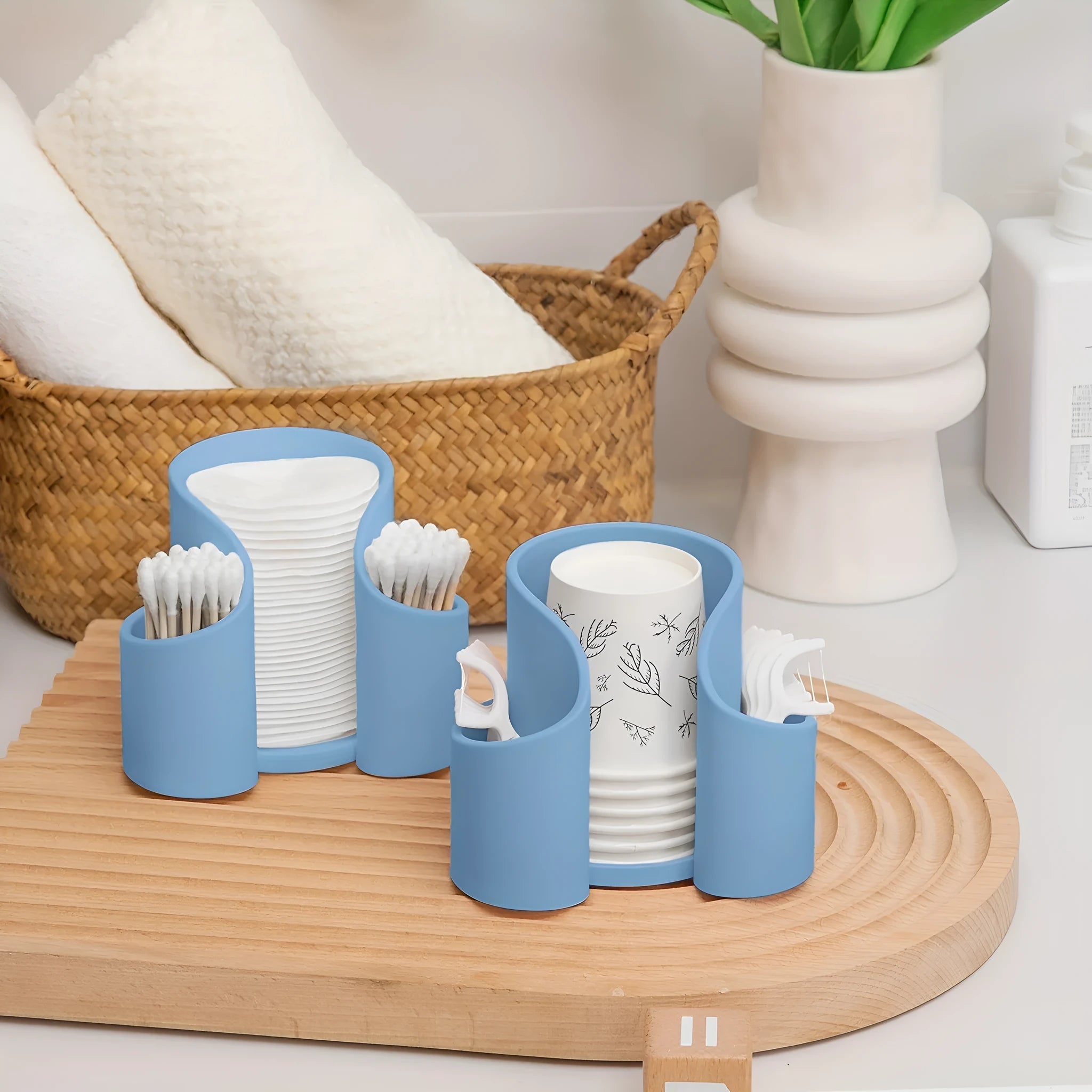 A solid-colour plastic cotton box with a lid for storing dental floss or cotton buds.