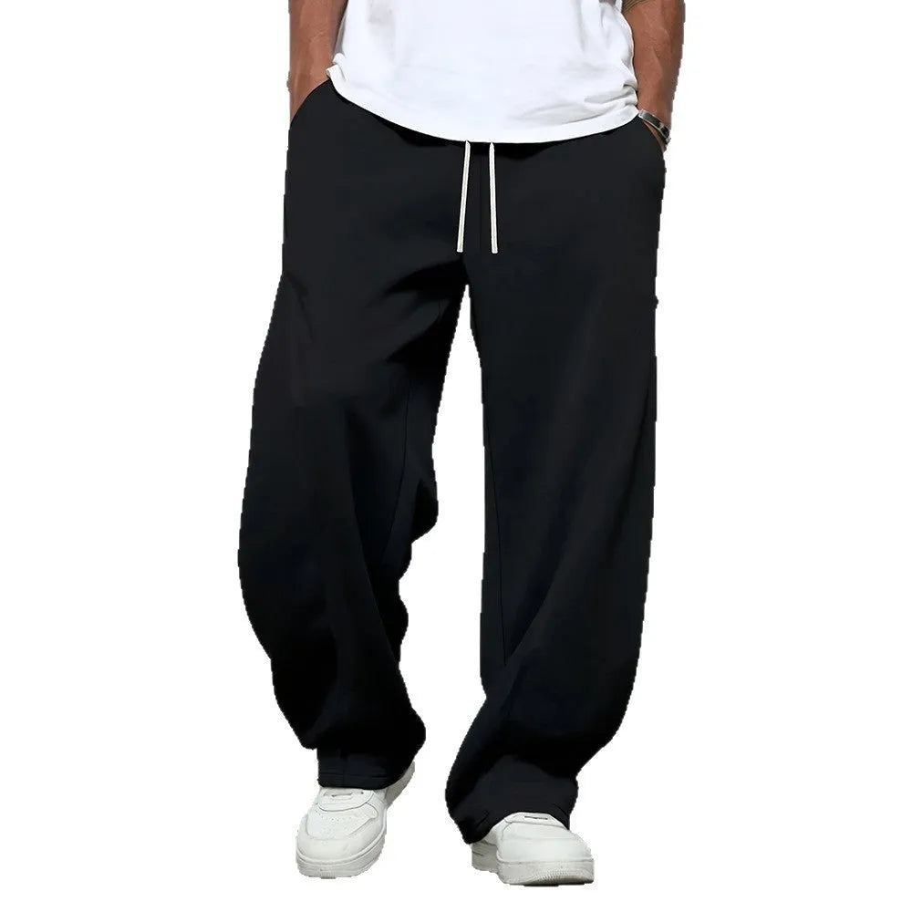 Men's straight-leg casual trousers in black with a micro-elastic drawstring waistband.