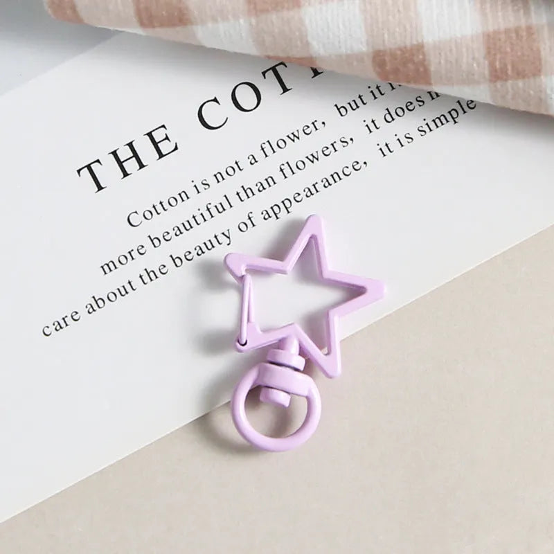 Metal five-pointed star snap button keychain with colour paint finish in alloy, small size, thirteen colour options including beige and sapphire blue