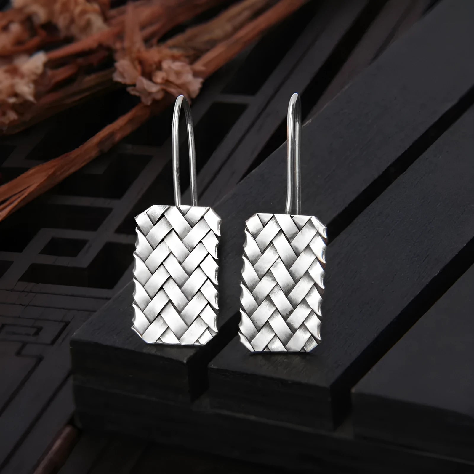 Silver geometric woven plaid earrings measuring 17.5mm by 11mm