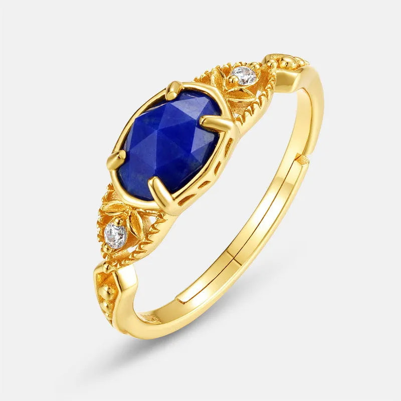Geometric silver alloy ring with blue lapis lazuli stone centrepiece, elliptical Japanese style design.