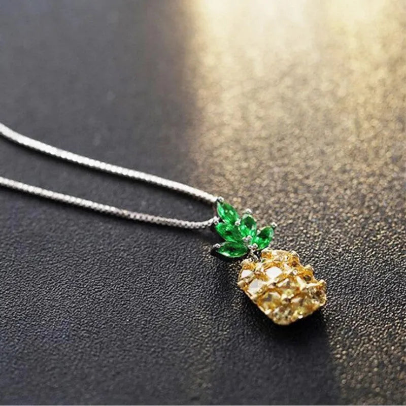 Silver geometric pineapple diamond necklace on white background