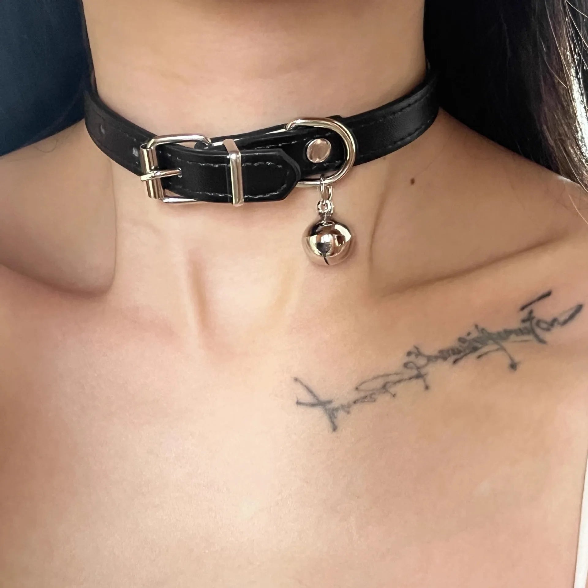 Black adjustable choker necklace with little bell charm on leather collar