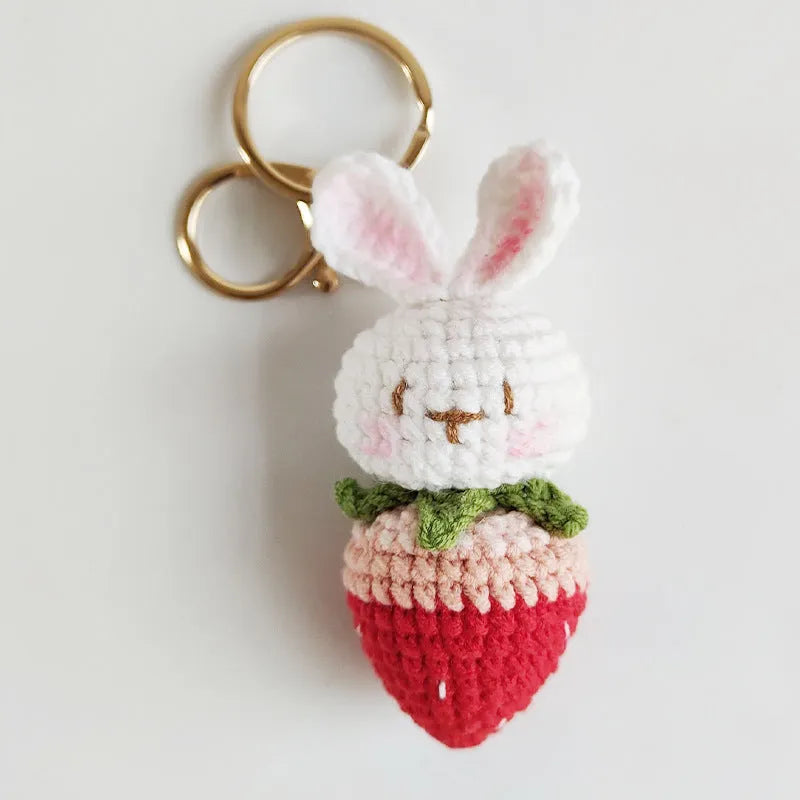Hand-woven white rabbit strawberry pendant keychain made from four-strand doll wire.