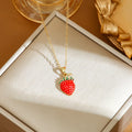 Golden indie necklace with detailed cherry, strawberry, and pepper pendant on a titanium steel O-ring chain.