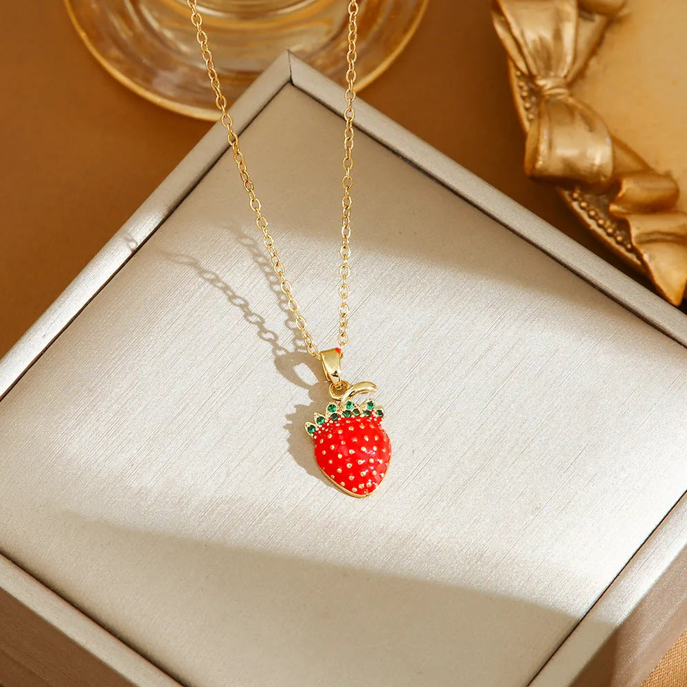 Golden indie necklace with detailed cherry, strawberry, and pepper pendant on a titanium steel O-ring chain.