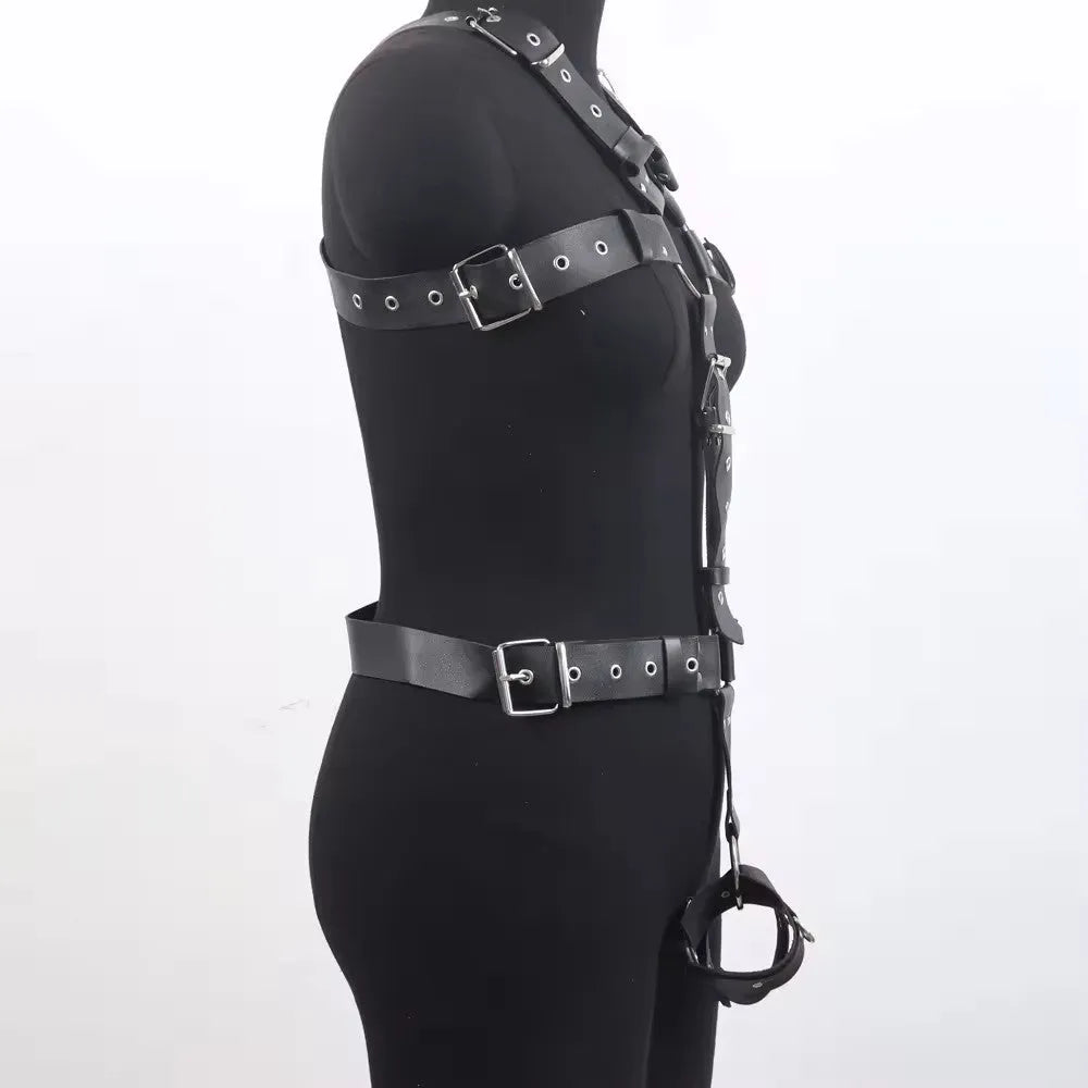 Black patent leather finish shapewear bodysuit with thin straps and a front pin buckle closure.