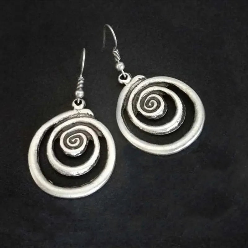 Geometric spiral earrings with distressed silver finish measuring 2.6cm wide by 5cm long