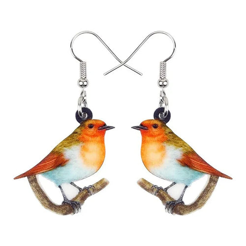 Acrylic clip-on earrings with a blue titmouse bird and geometric snake design.
