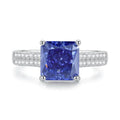 Heart-shaped sterling silver ring with a faceted colour zircon stone on a white background.