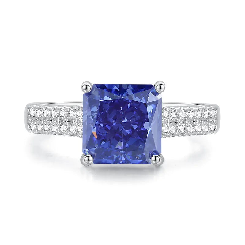 Heart-shaped sterling silver ring with a faceted colour zircon stone on a white background.