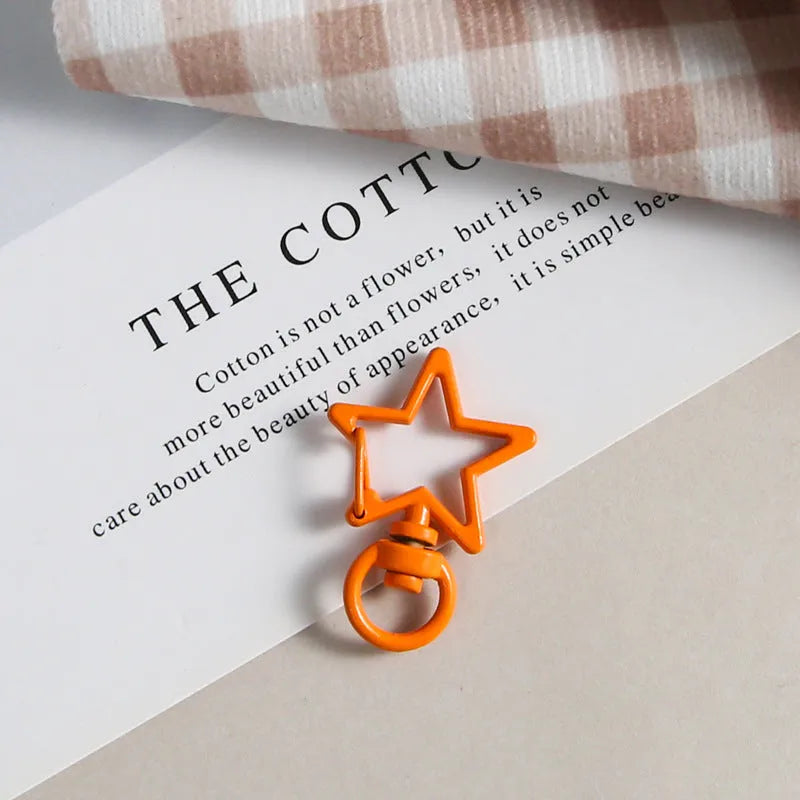 Metal five-pointed star snap button keychain with colour paint finish in alloy, small size, thirteen colour options including beige and sapphire blue