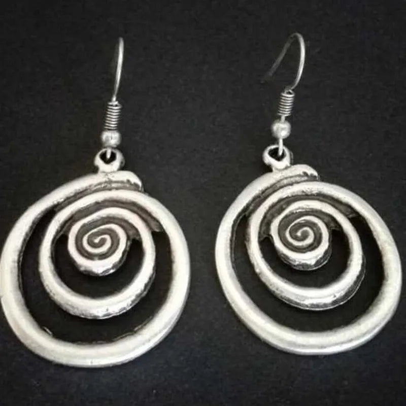 Geometric spiral earrings with distressed silver finish measuring 2.6cm wide by 5cm long