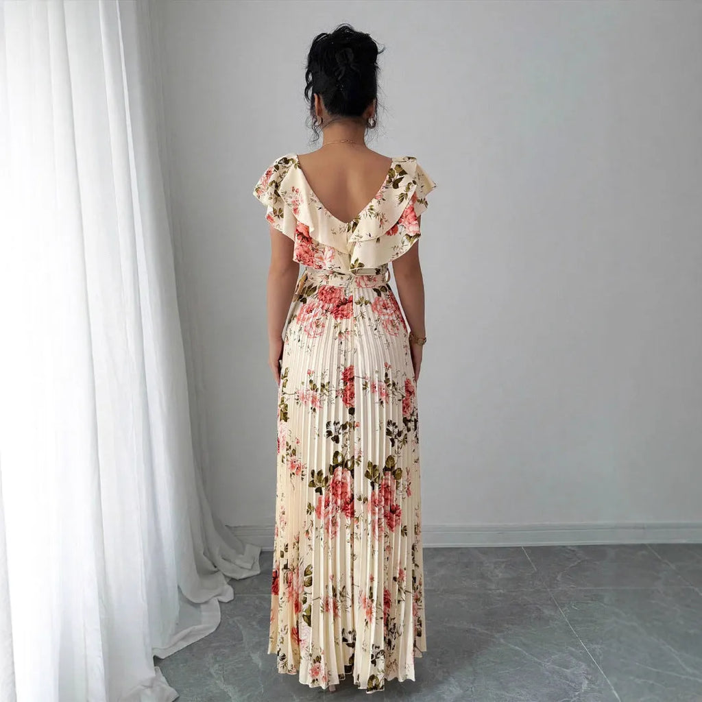 Apricot floral print women's dress with V-neck, ruffle sleeves, and a high-waisted swing skirt.