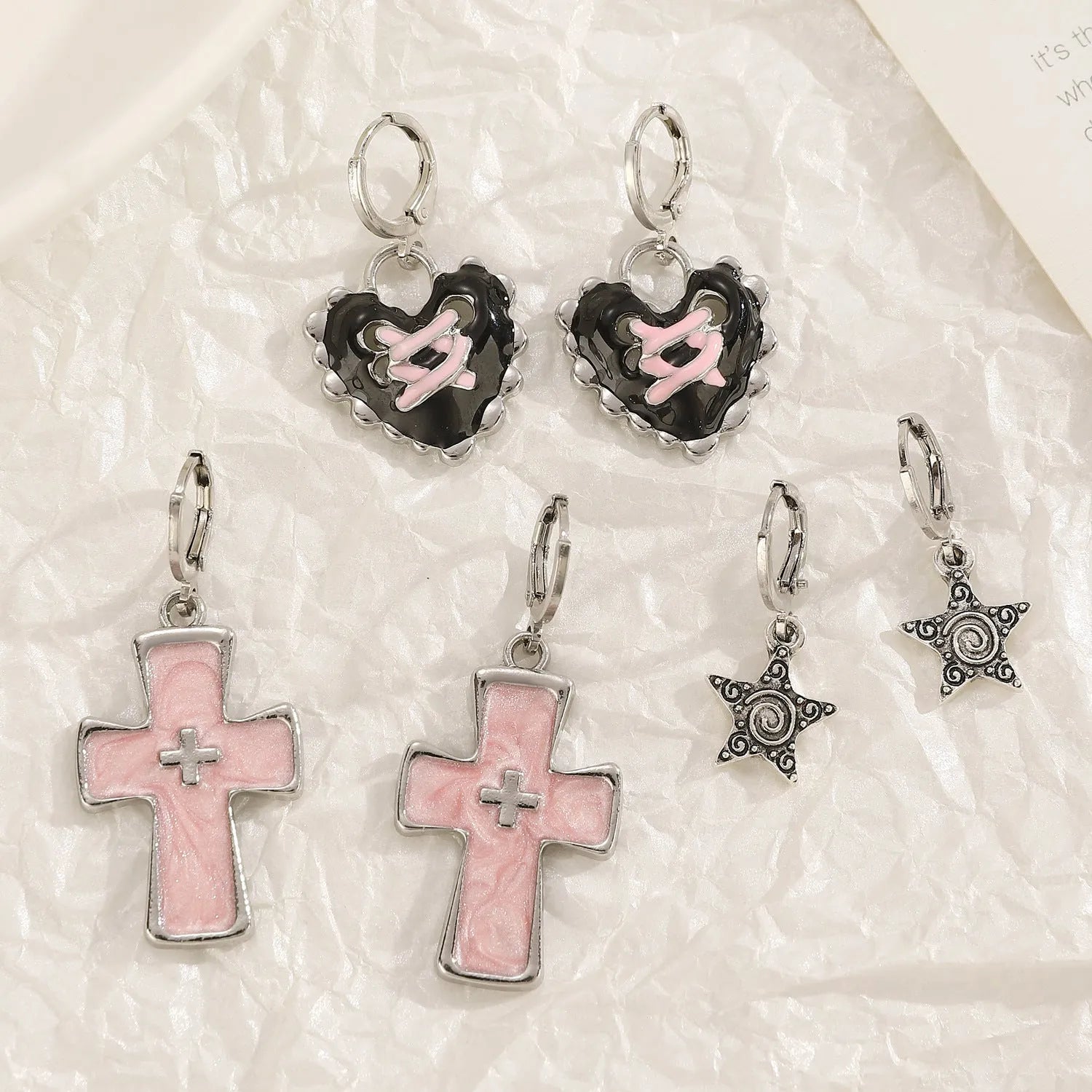 Women's alloy earrings with cross and heart designs in five colour variations including white, black cat, and antique silver
