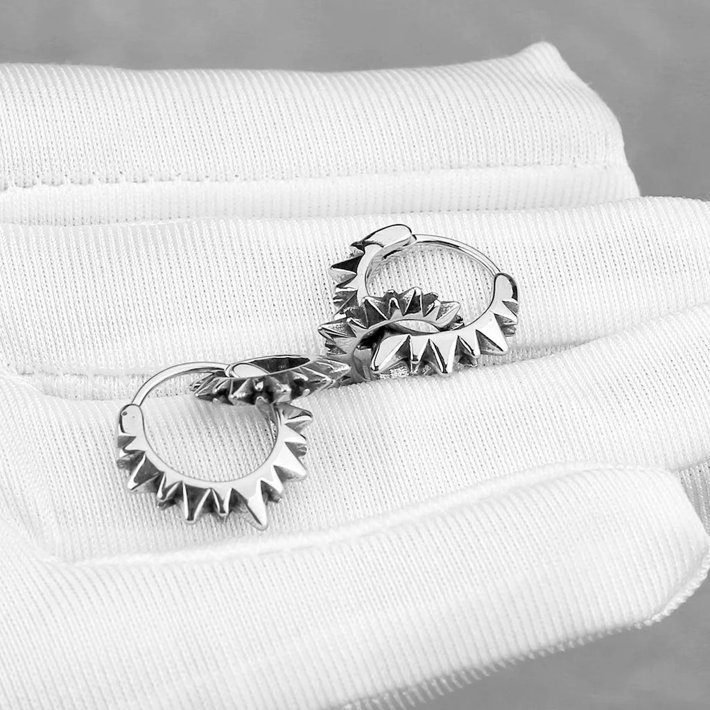 Polished stainless steel round ring earrings with retro design in steel colour