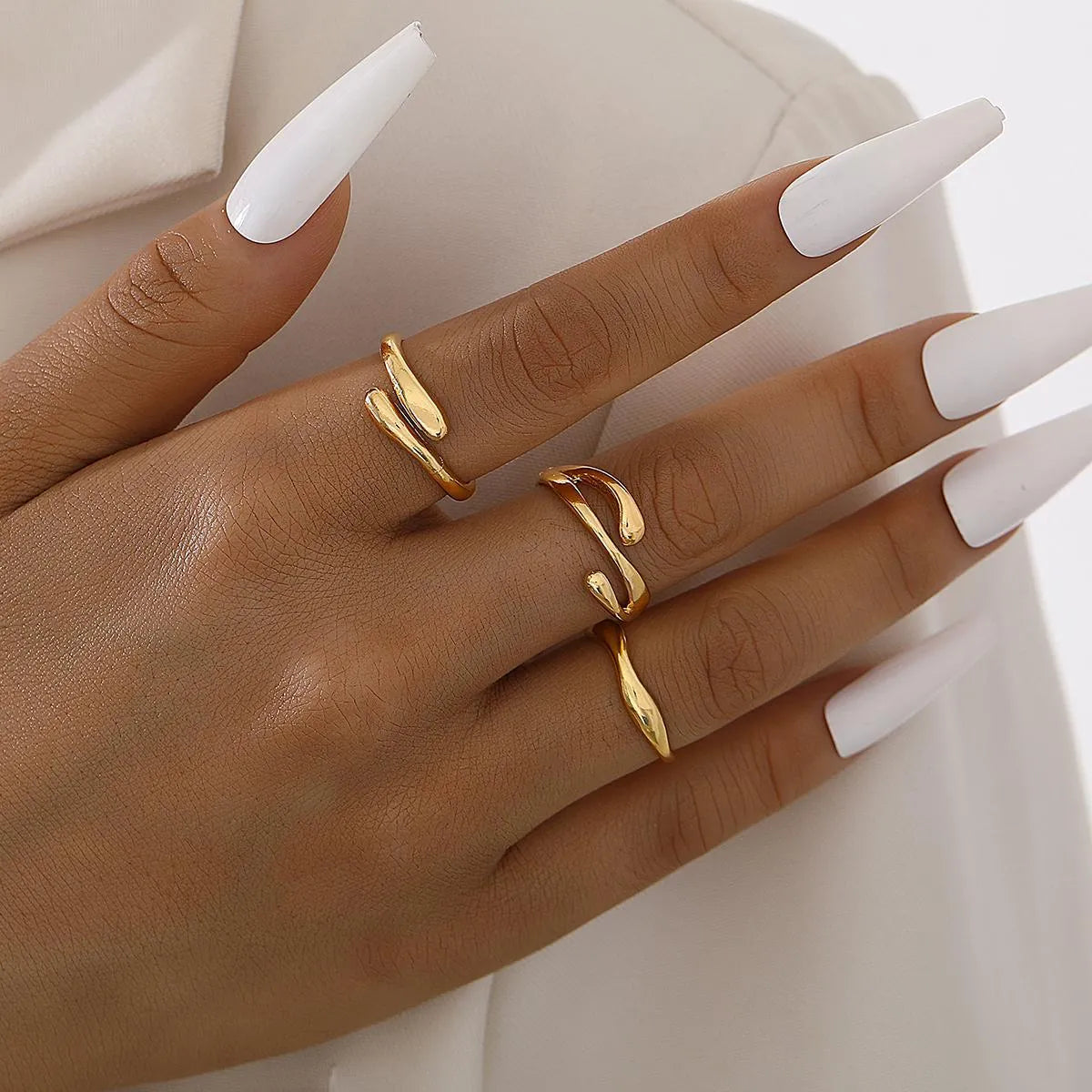Women's irregular water drop ring suit 3-piece set in gold alloy on white background