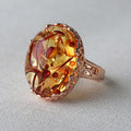 Amber ring with beeswax carving detail in New Amber Type A colour on alloy band