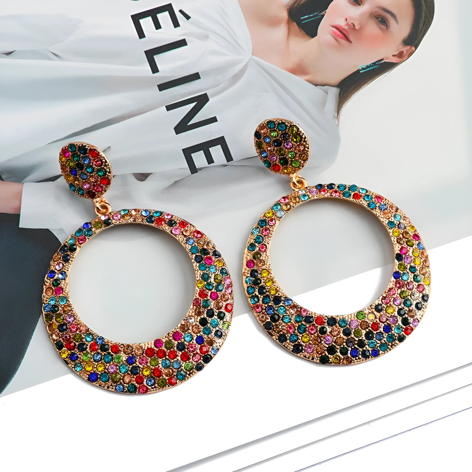 Colourful large round pendant earrings with metal diamond accents in cartoon style