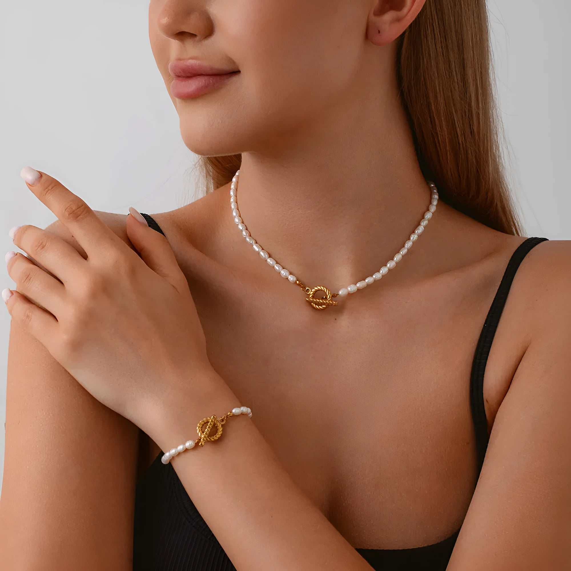 Women's adjustable freshwater pearl necklace and bracelet set with geometric stainless steel pendant