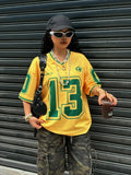 Women's loose fit V-neck short sleeve t-shirt with raised 3D letter print design on the front.