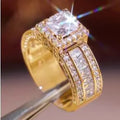 A geometric silver-tone women's ring with round elements, shown in gold and white colour options.