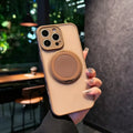 Frosted transparent magnetic phone case with a built-in stand for iPhone, shown in plum colour.