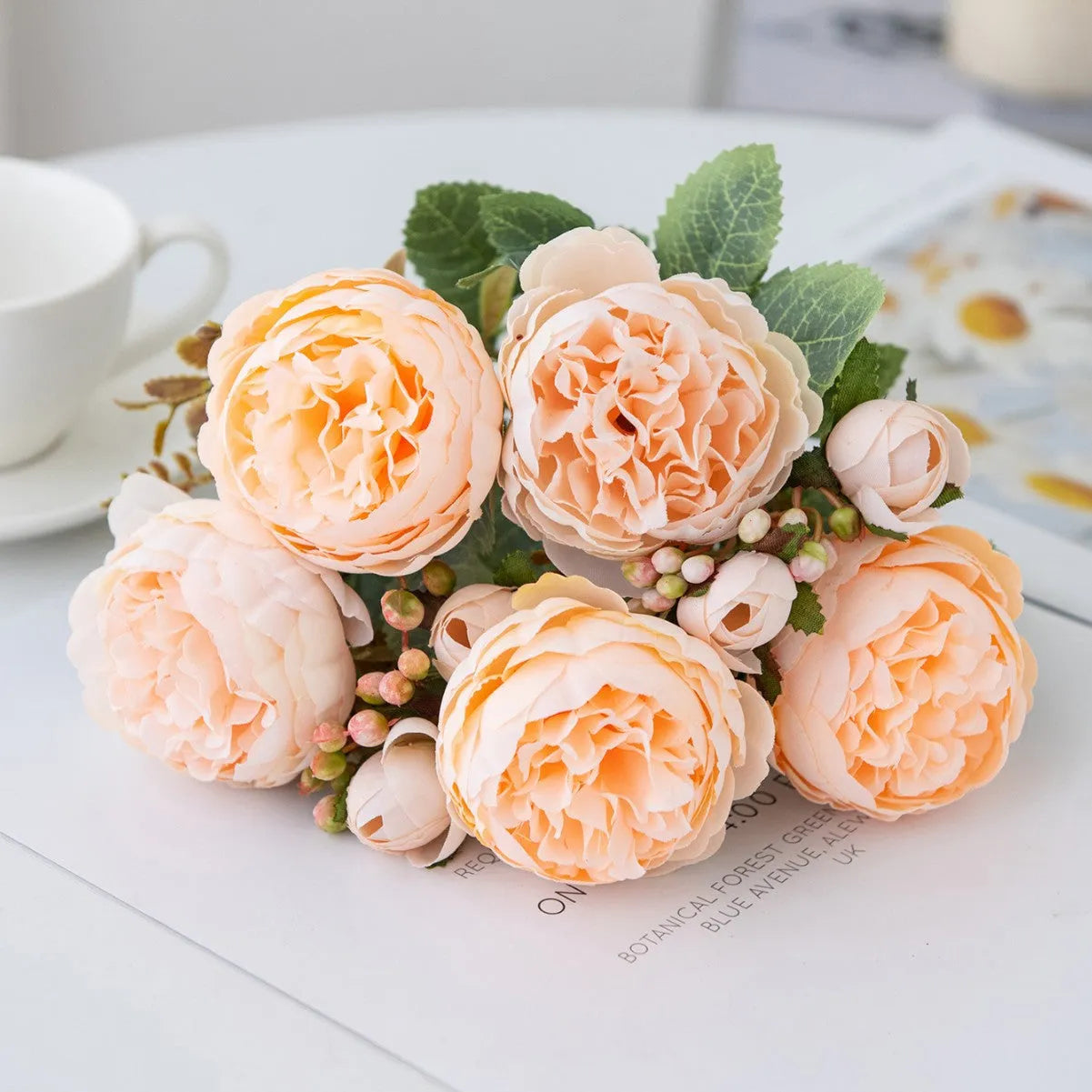 Silk artificial peony flower bouquet in champagne colour for home or wedding decoration.
