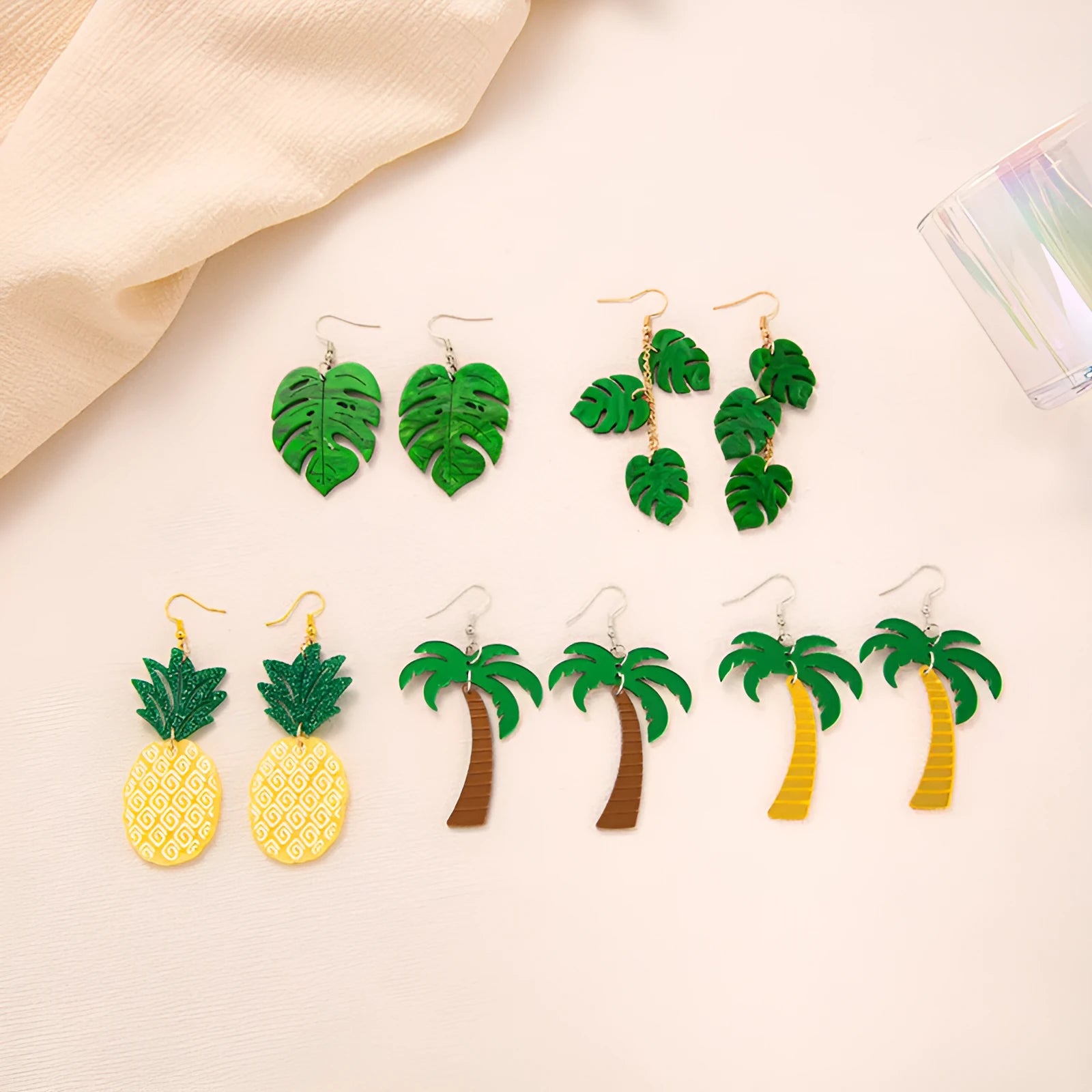 Drop shape earrings with a white acrylic coconut artocarpus charm and silver alloy hook.