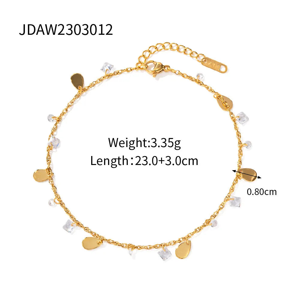 Stainless steel women's anklet with a geometric water drop tassel charm on an ankle.