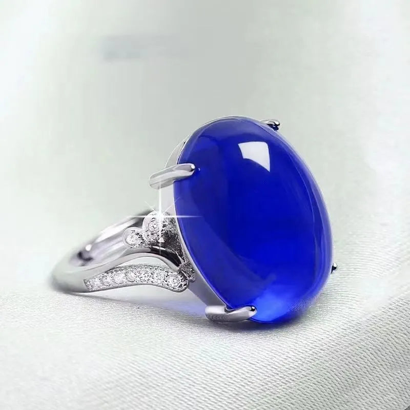 Adjustable ethnic geometric alloy ring showing five colour variations: black, blue, green, red, yellow