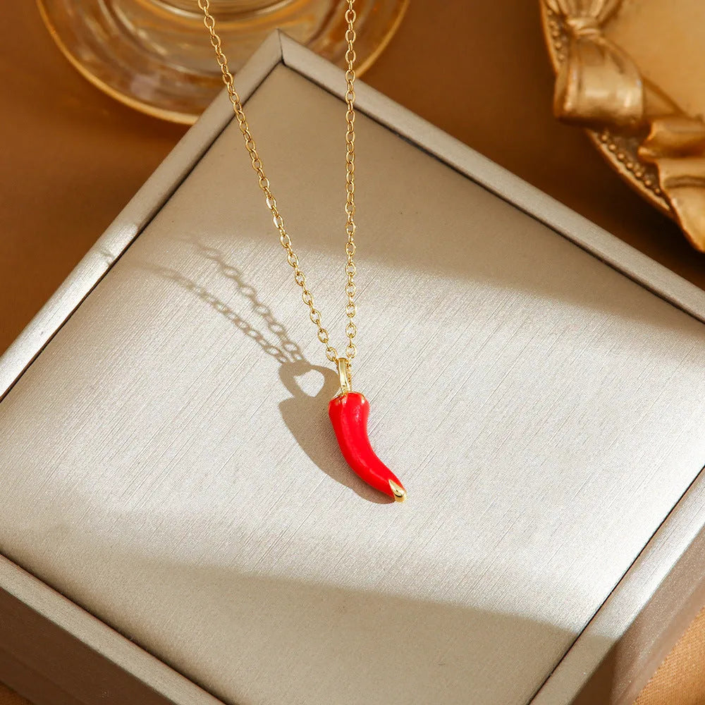 Golden indie necklace with detailed cherry, strawberry, and pepper pendant on a titanium steel O-ring chain.
