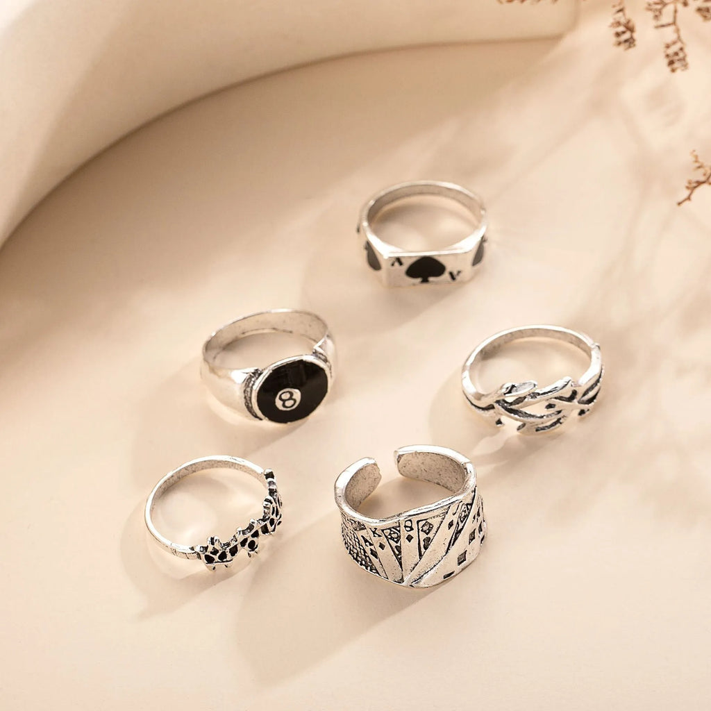 Black alloy ring featuring a detailed retro spade card design on an adjustable band.